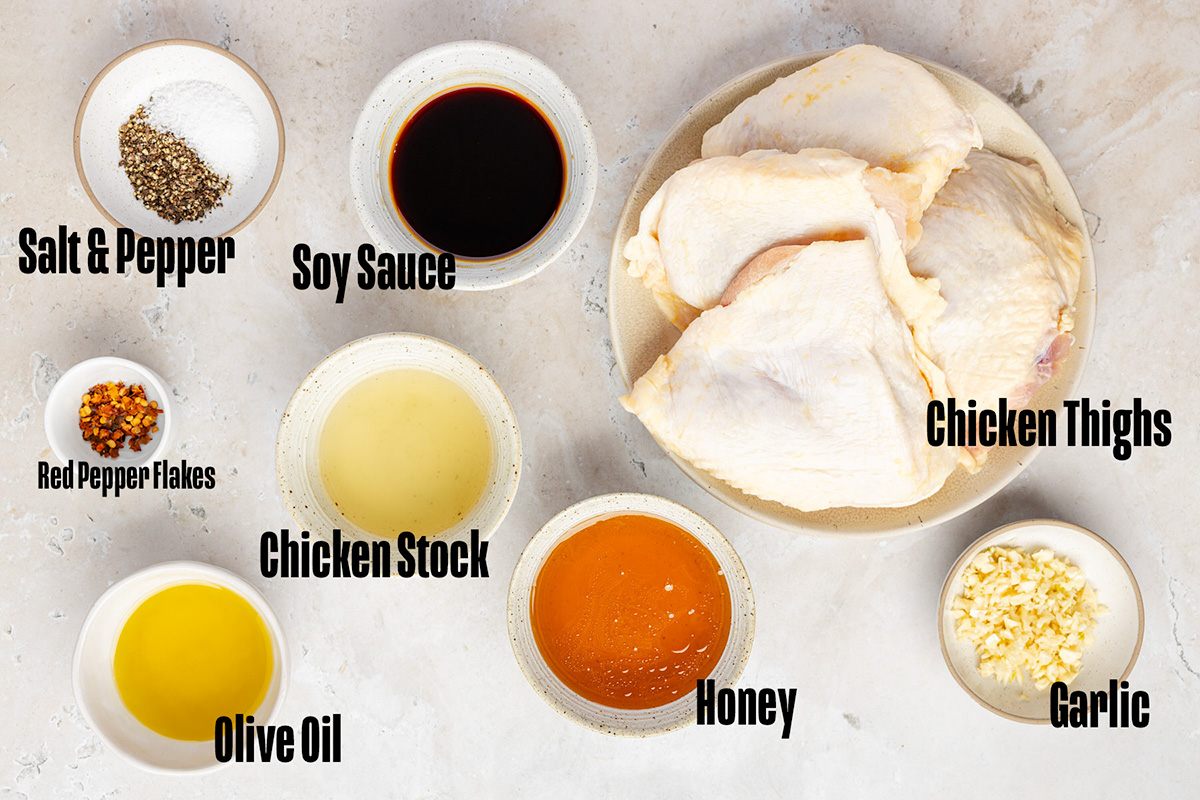 Ingredients to make honey garlic chicken thighs on a table.