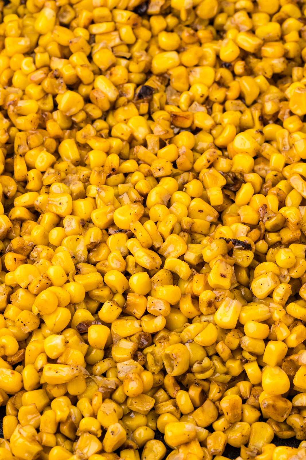 Close-up of caramelized garlic butter corn kernels