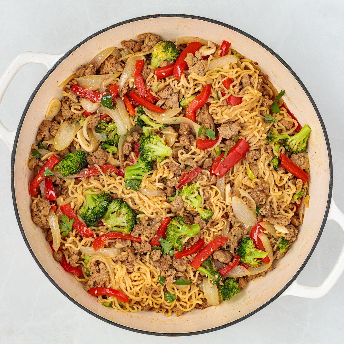 Ground turkey stir fry in a large pot.