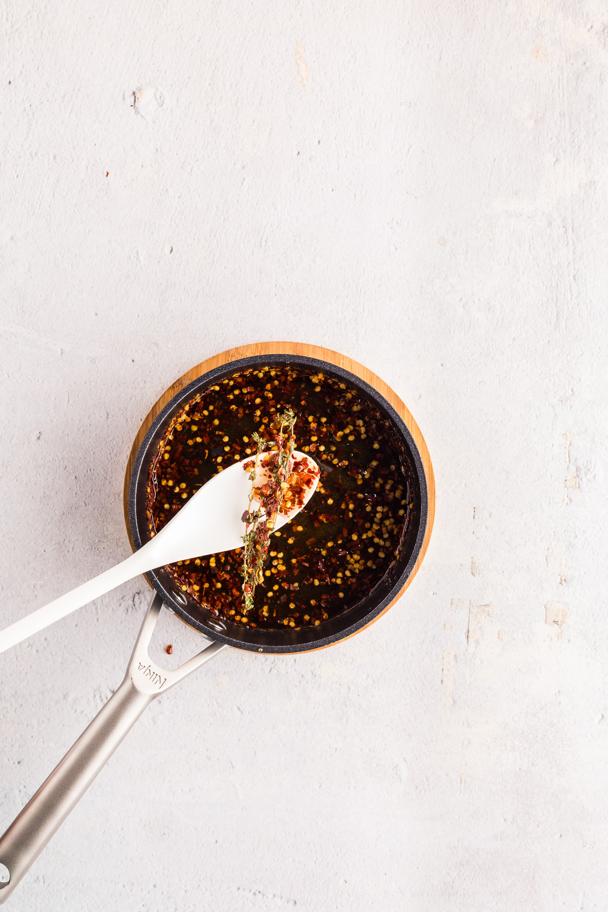 Bubbles forming along the edge of the pot while making hot honey