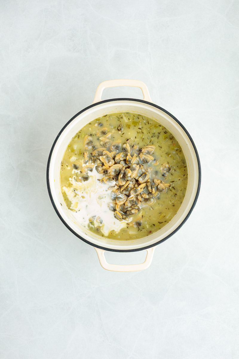 Heavy cream added to the dutch oven.