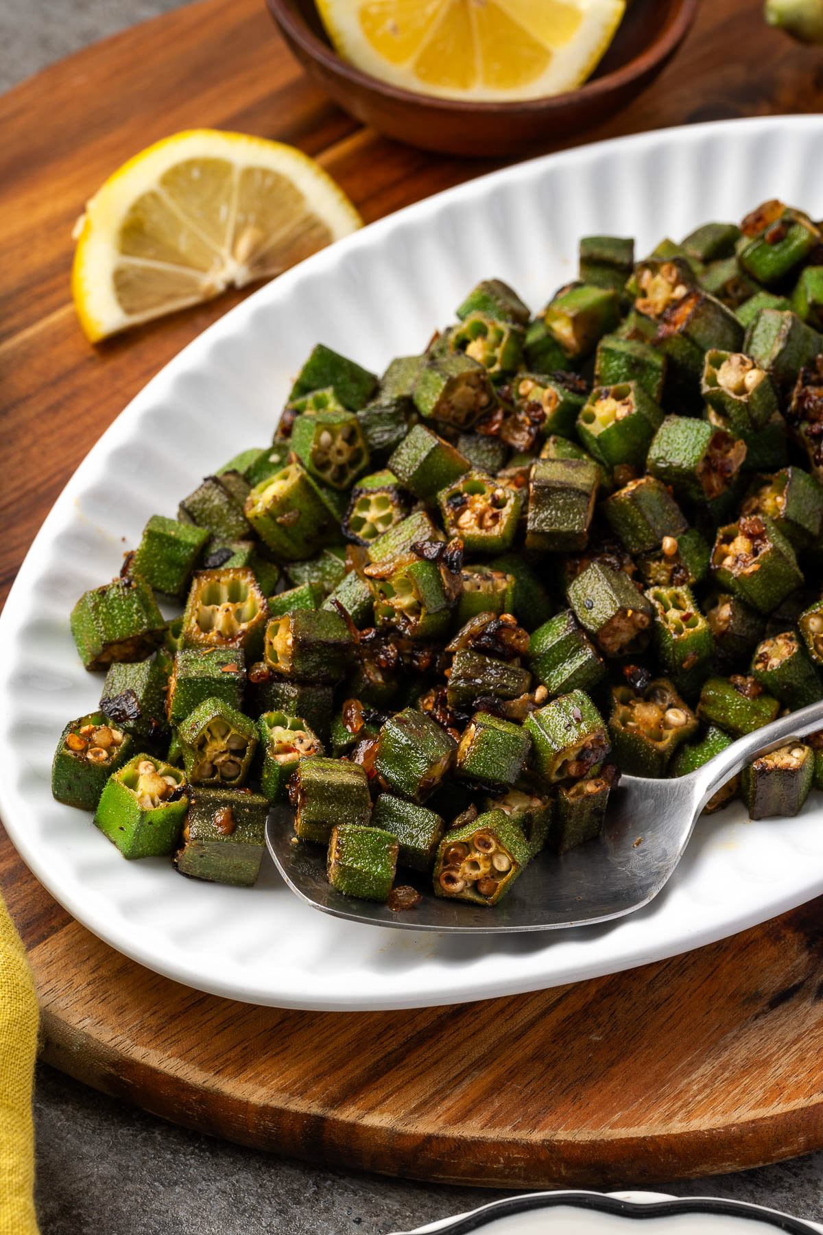 Pan-Fried Okra served on a white plate.