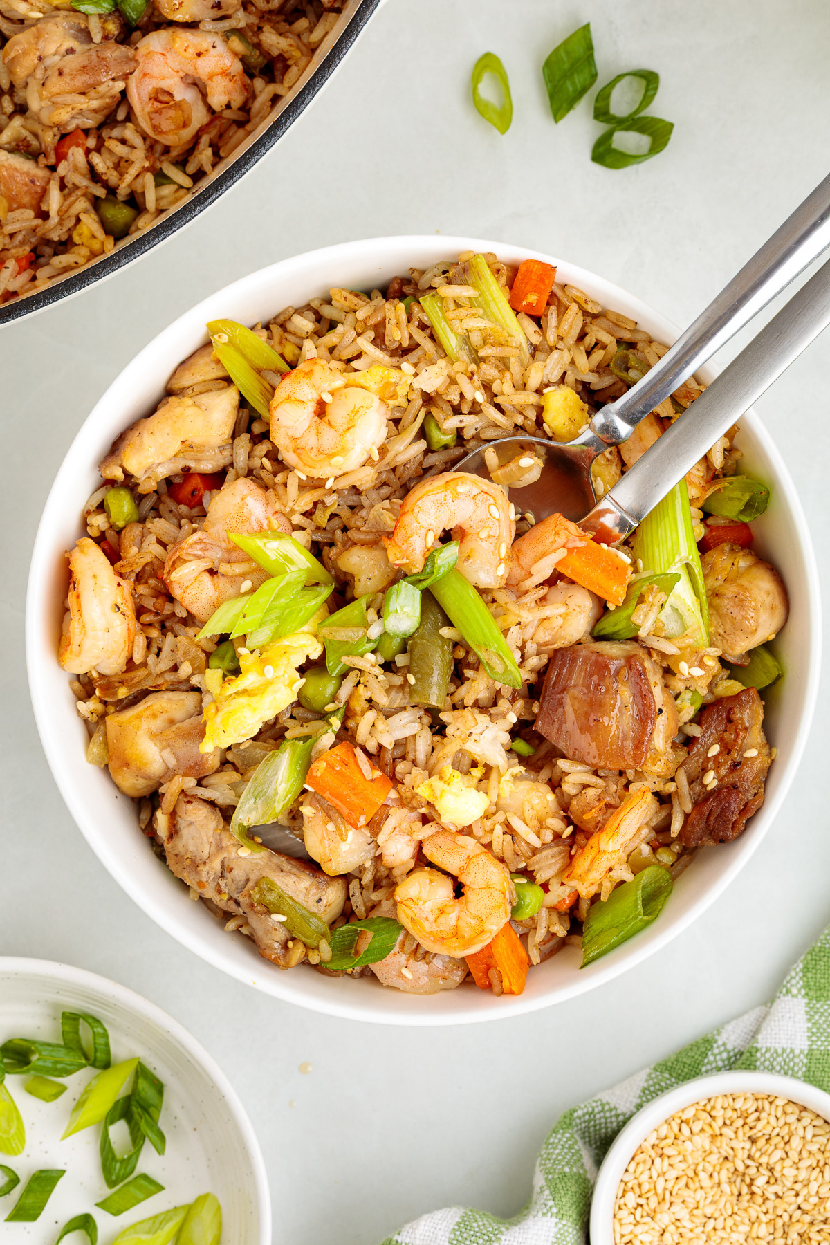 A dish of shrimp and chicken fried rice on a table. 