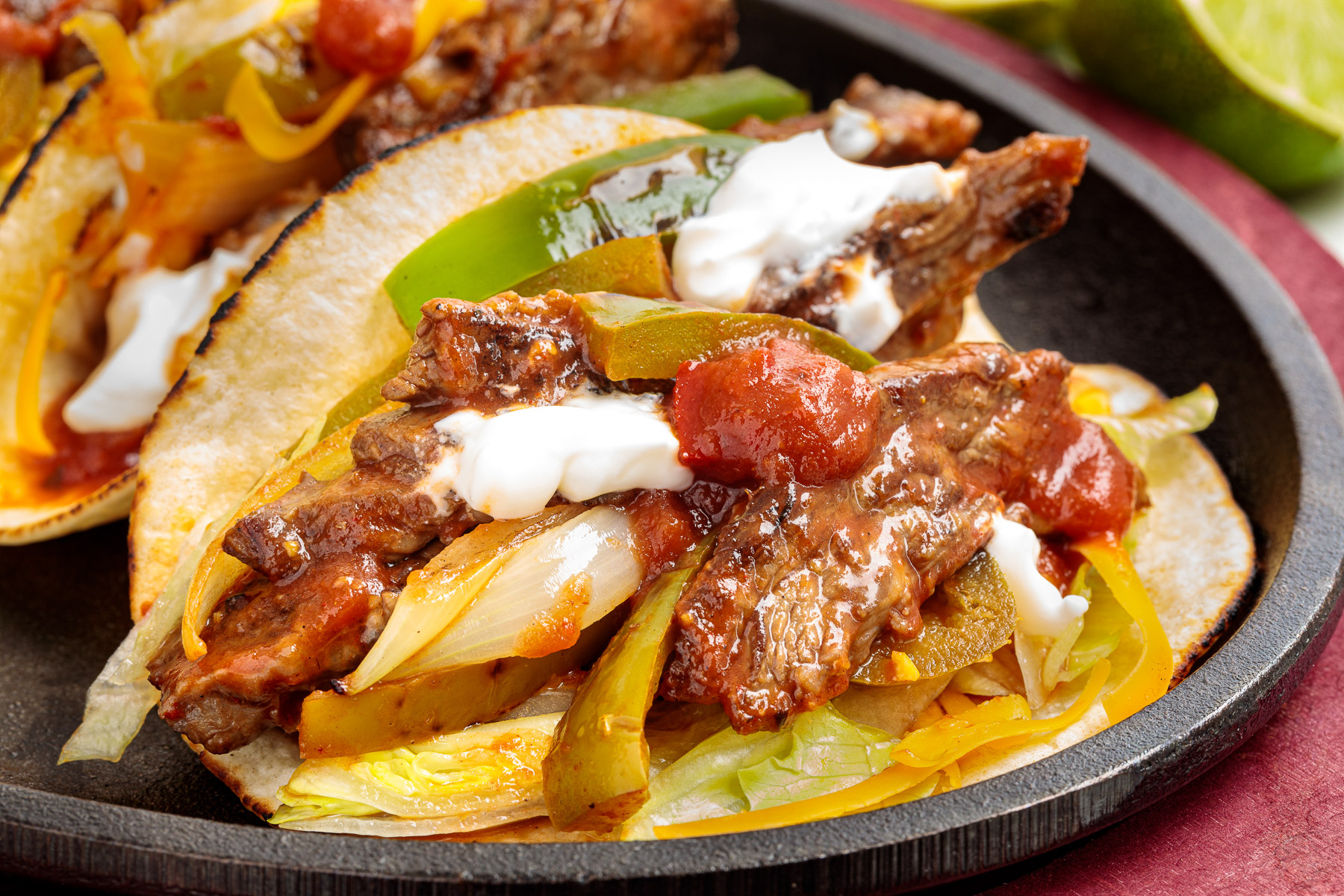fajitas in a cast iron skillet.