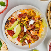 Skillet Fajitas in a warm tortilla with all the toppings.