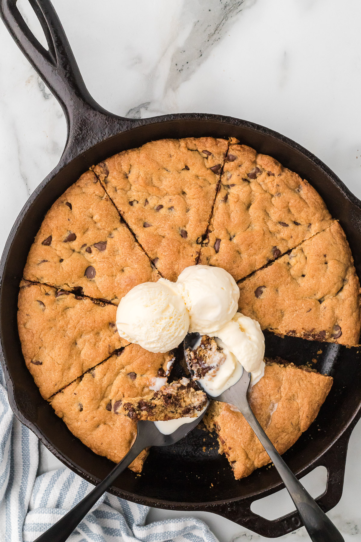 Finished skillet cookie, warm with melted chocolate visible
