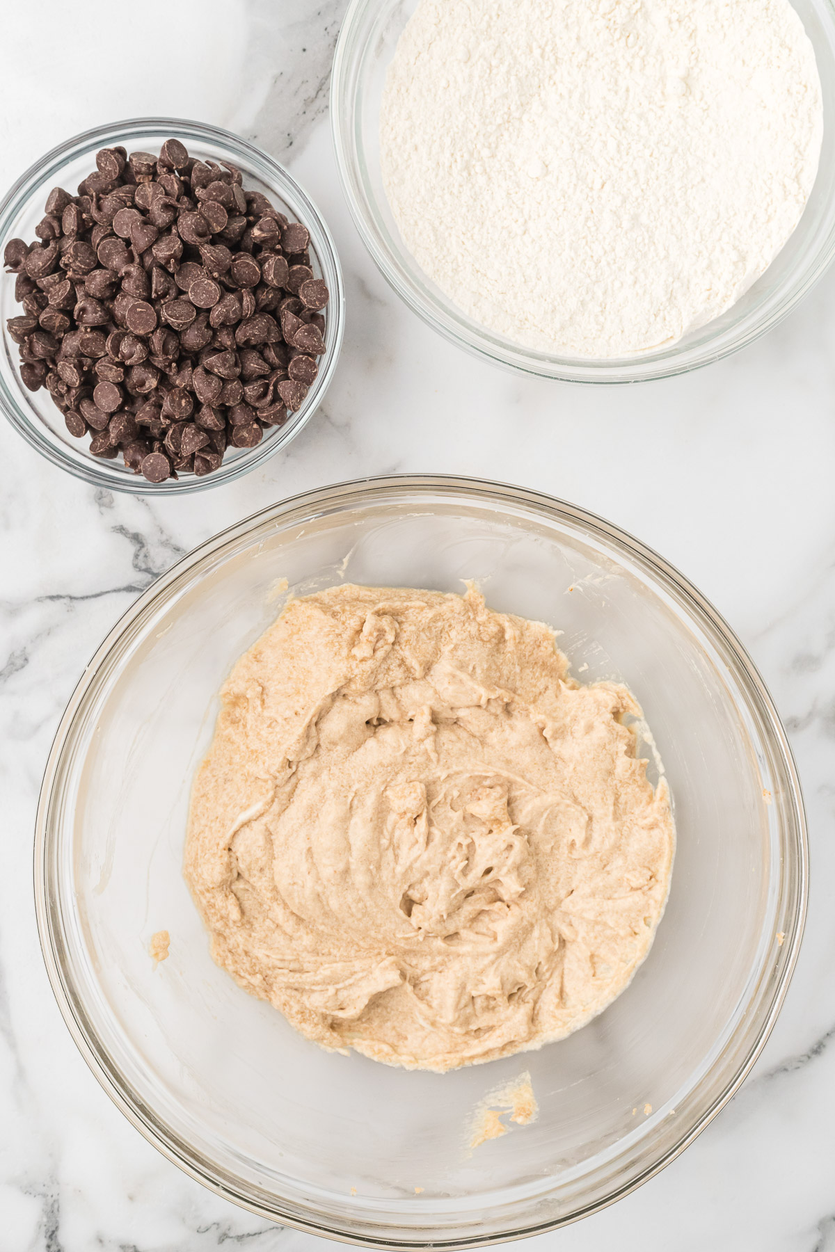 Mixing dry ingredients into sourdough cookie dough.