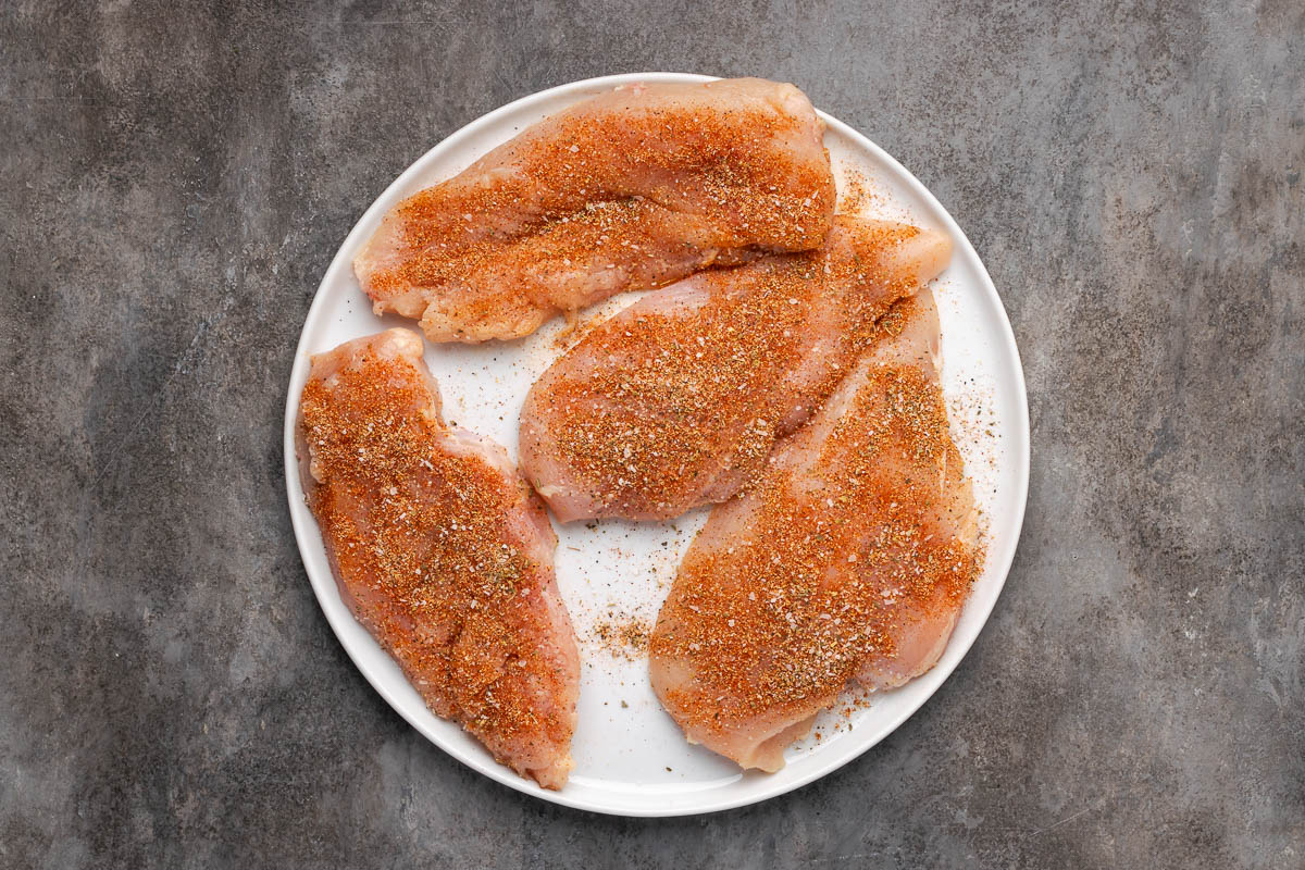 Chicken seasoned with kosher salt, black pepper, garlic powder, smoked paprika, onion powder, and Italian seasoning. 