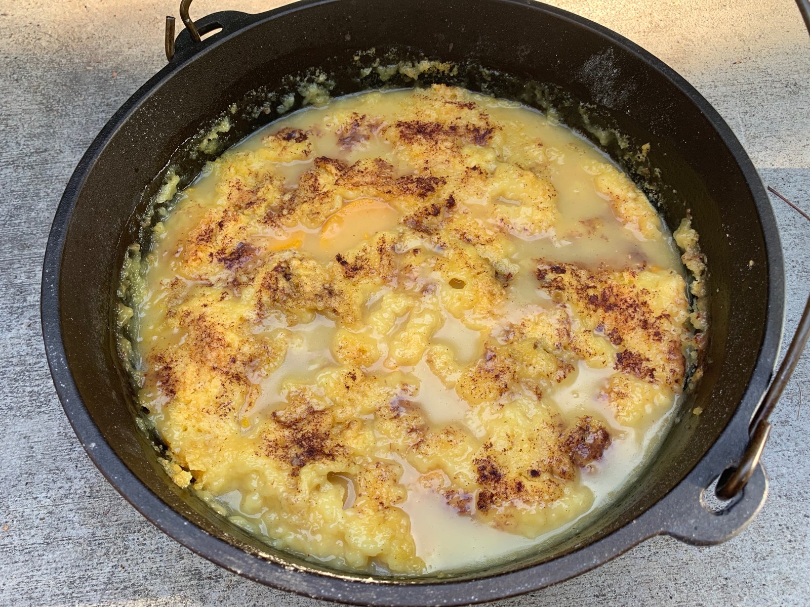 Dutch oven peach dump cake after cooking.