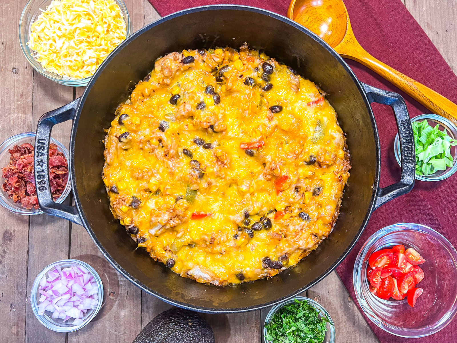 Freshly cooked BBQ chicken and rice in the dutch oven with optional toppings