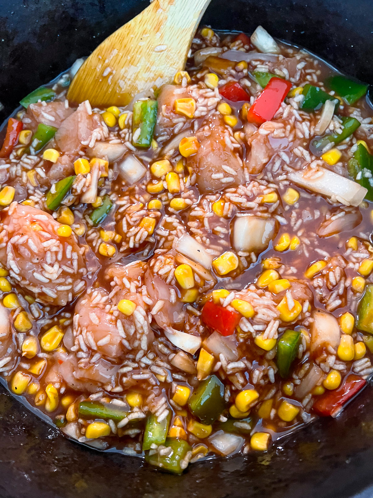 BBQ sauce, soy sauce, Worcestershire sauce, and chicken broth added to the dutch oven