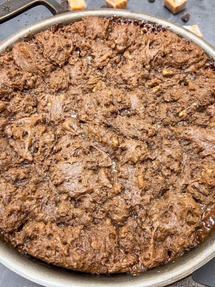 Cast iron skillet caramel brownies ready to serve