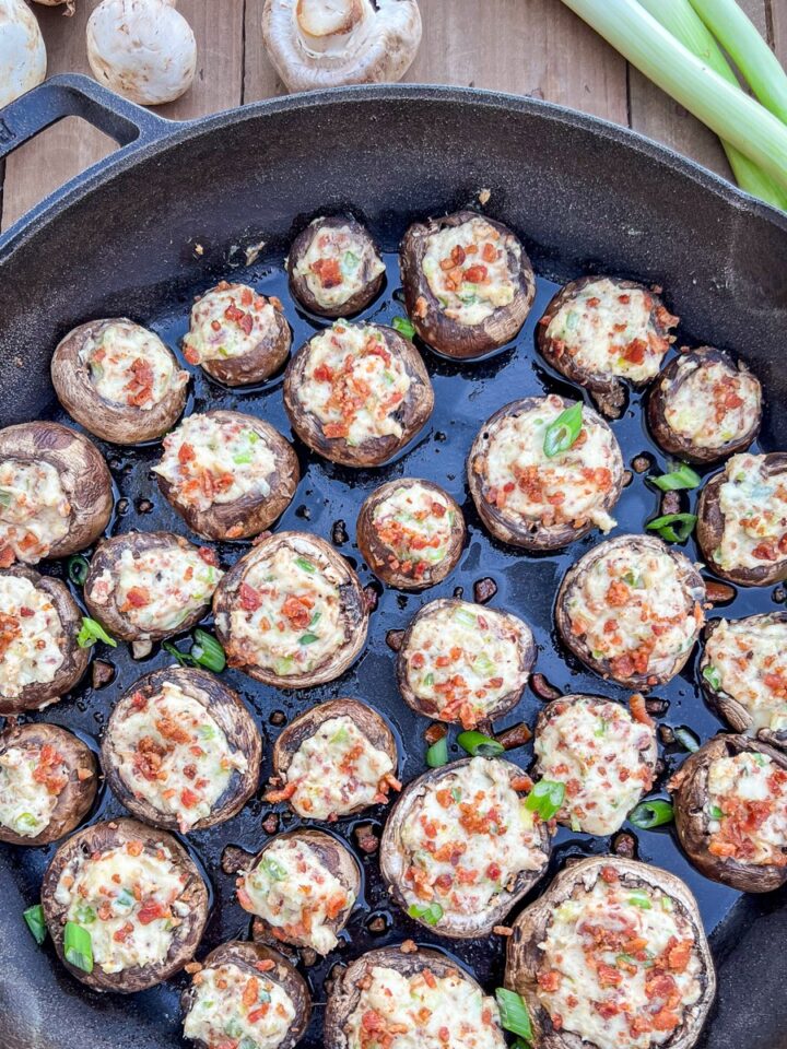 Dutch oven stuffed mushrooms with cream cheese and bacon in Lodge cast iron