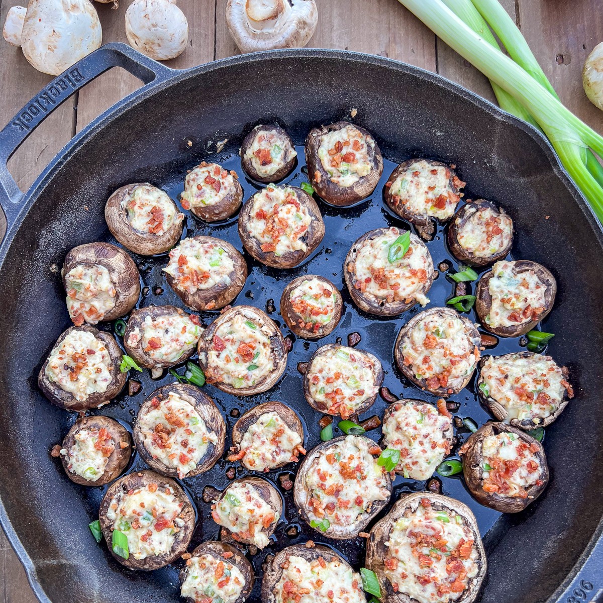 Dutch oven stuffed mushrooms with cream cheese and bacon in Lodge cast iron