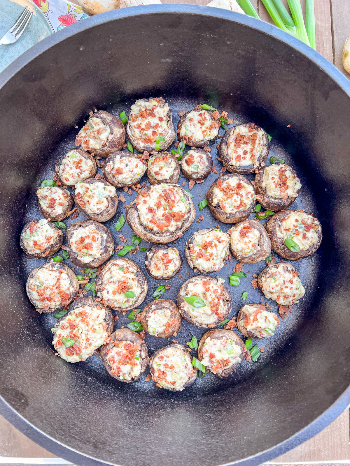 Finished cream cheese stuffed mushrooms in Dutch oven ready to serve