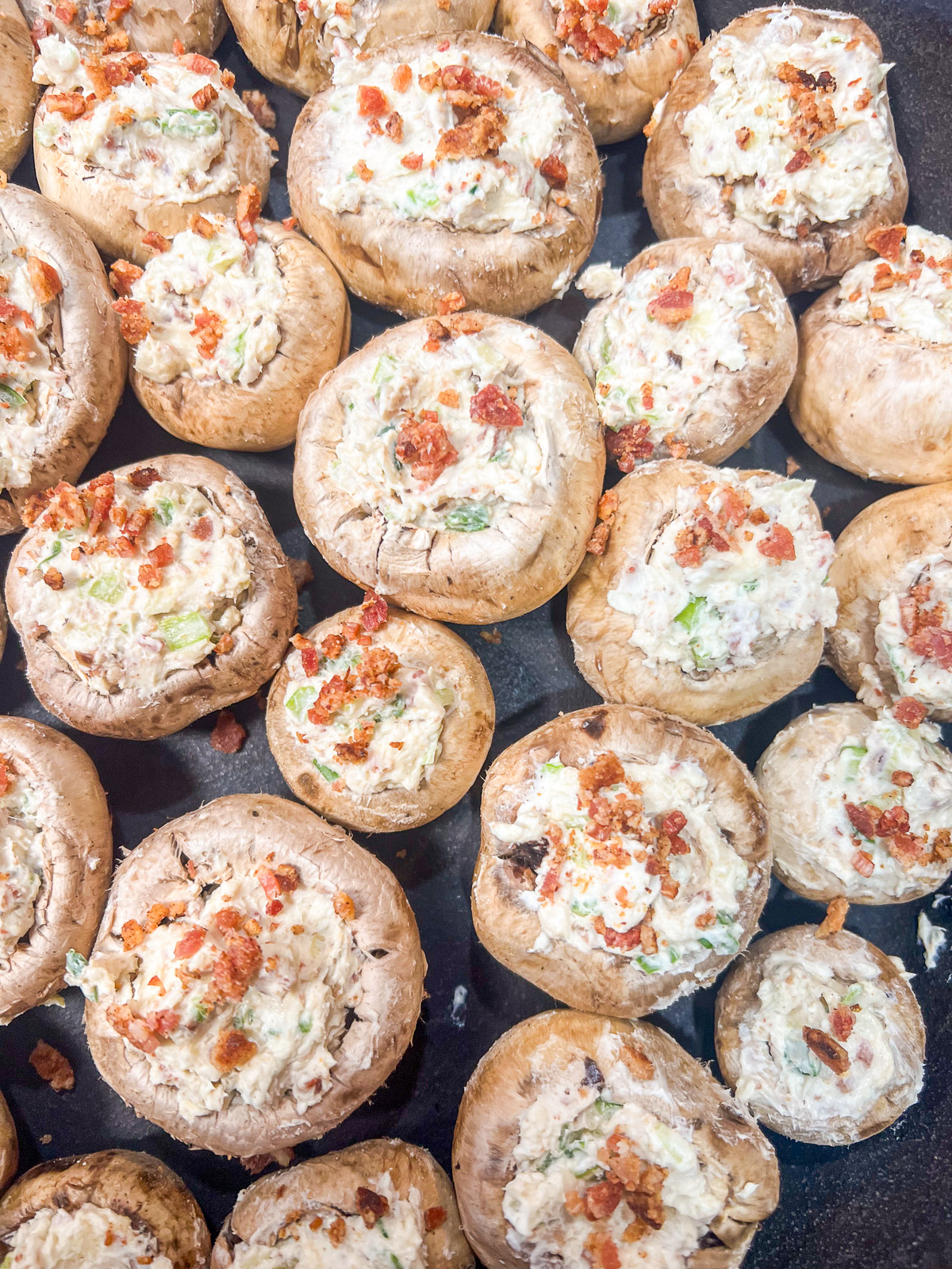 Stuffed mushrooms arranged in a 12-inch camp oven.