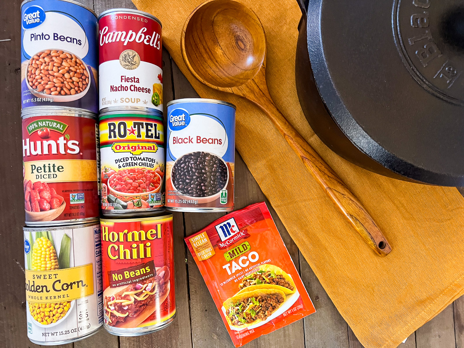 Ingredients for dutch oven 7 can soup including pinto beans black beans corn Rotel chili and nacho cheese sauce
