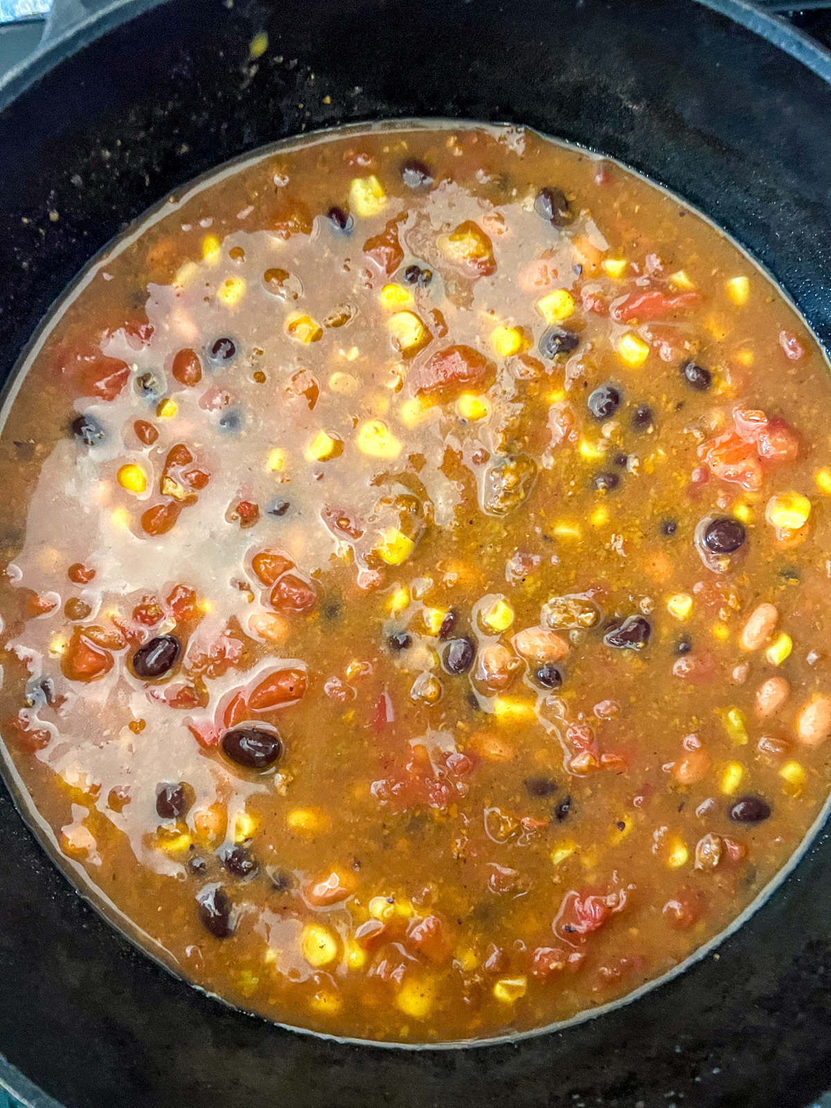 Dutch oven 7 can soup simmering and ready to serve