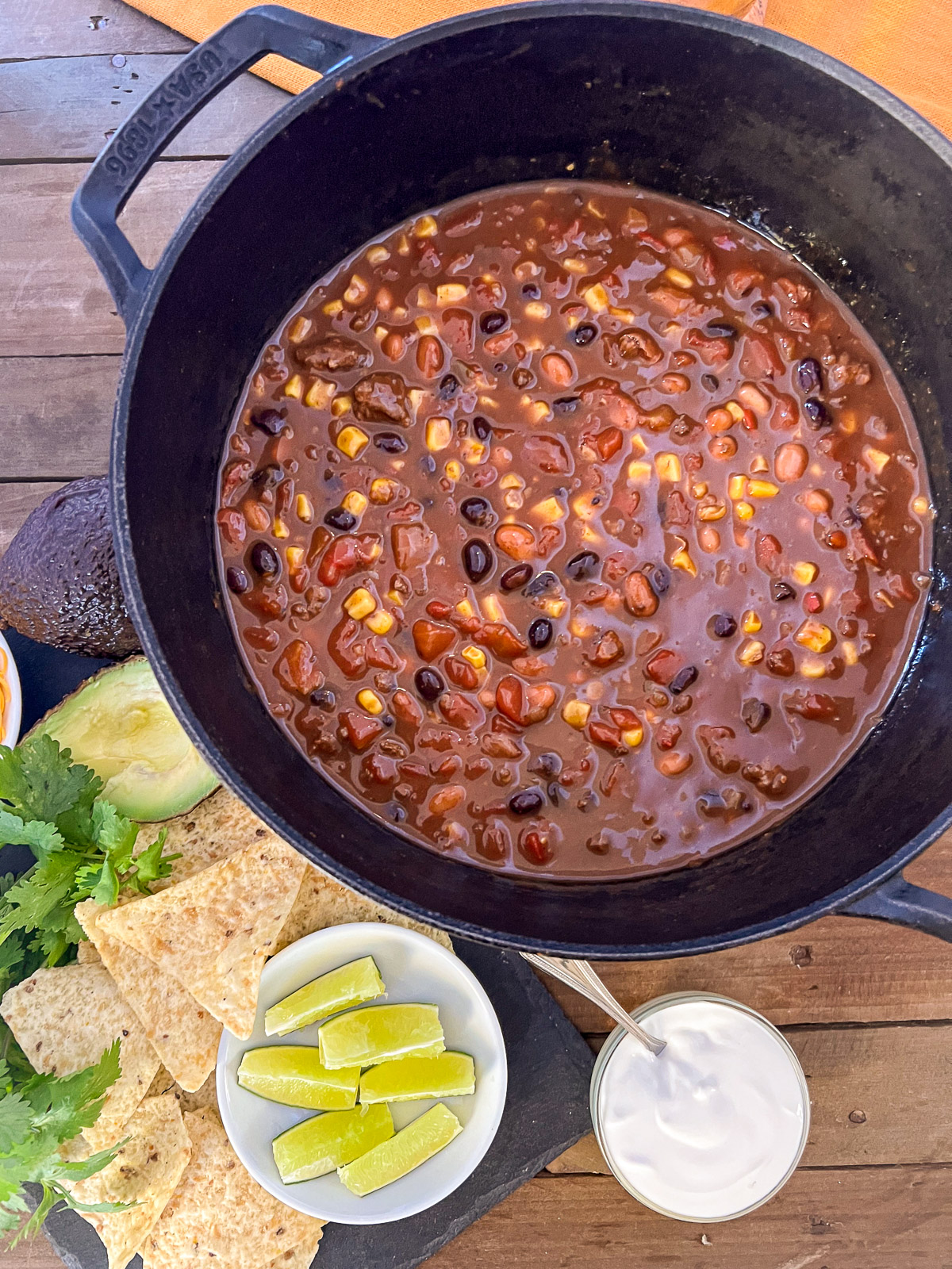 Dutch oven 7 can soup ready to serve with lime wedges sour cream and tortilla chips