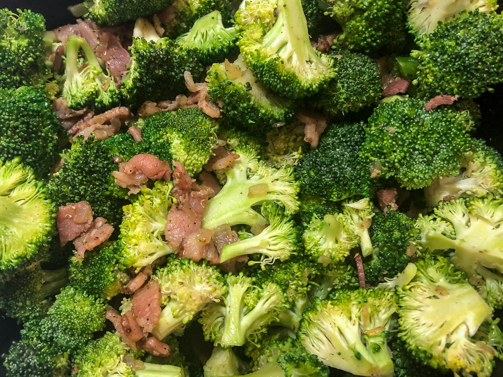 Broccoli florets added to the bacon and onion mixture in the Dutch oven