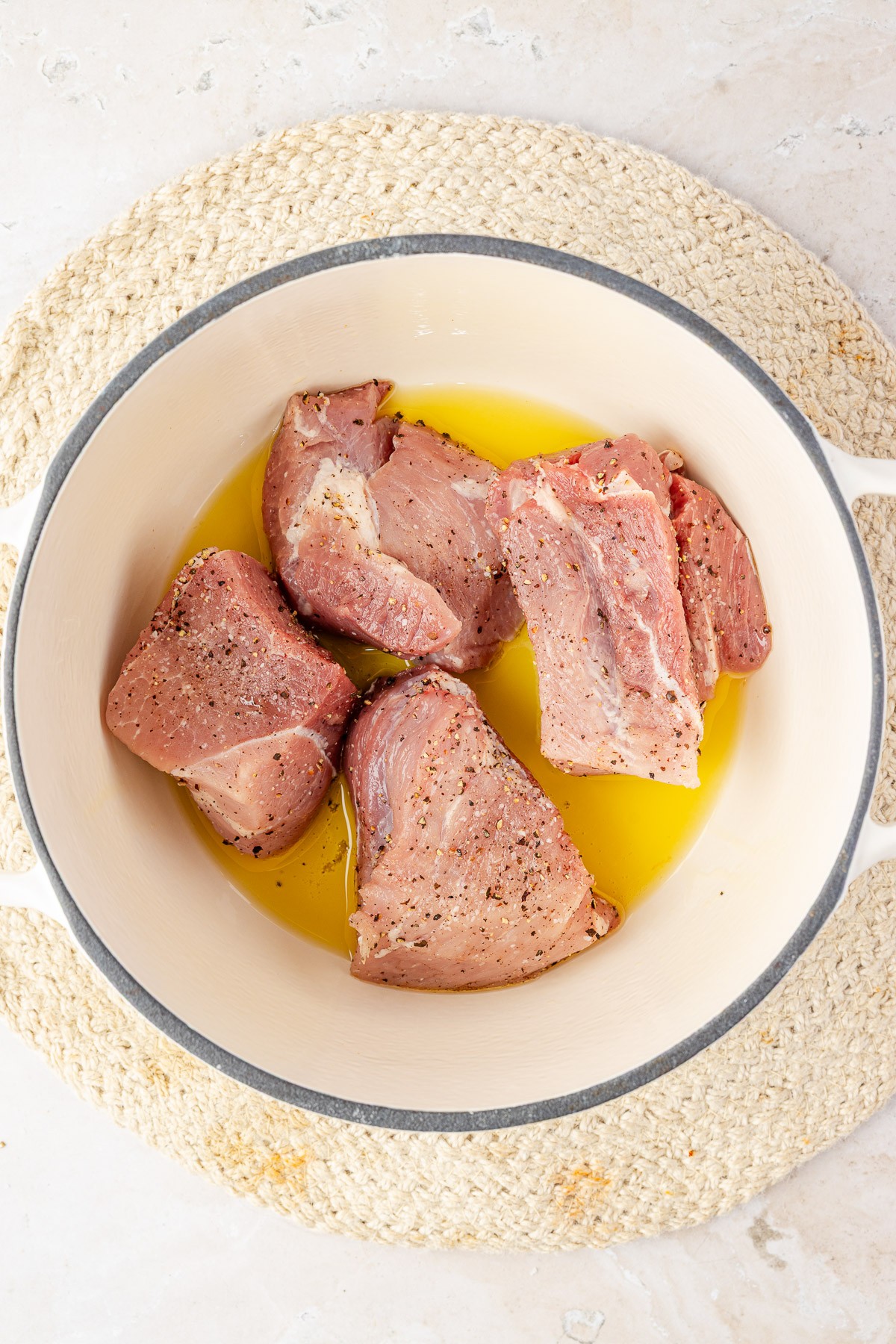 Pork searing in a dutch oven.
