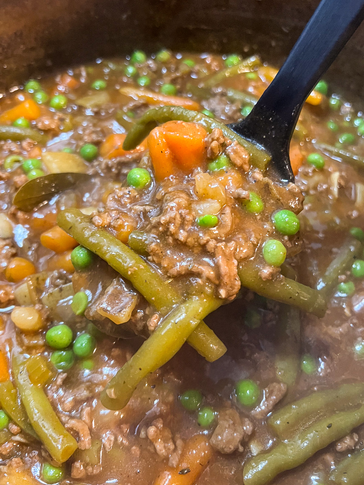 The ground beef stew is done and ready to be served.