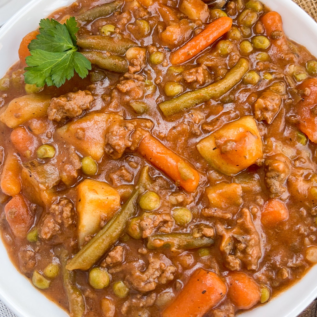 Close up of a bowlful of ground beef stew.