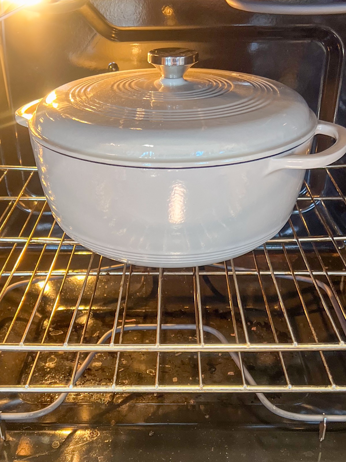 Covered Dutch oven braising in the oven at 325 degrees F.