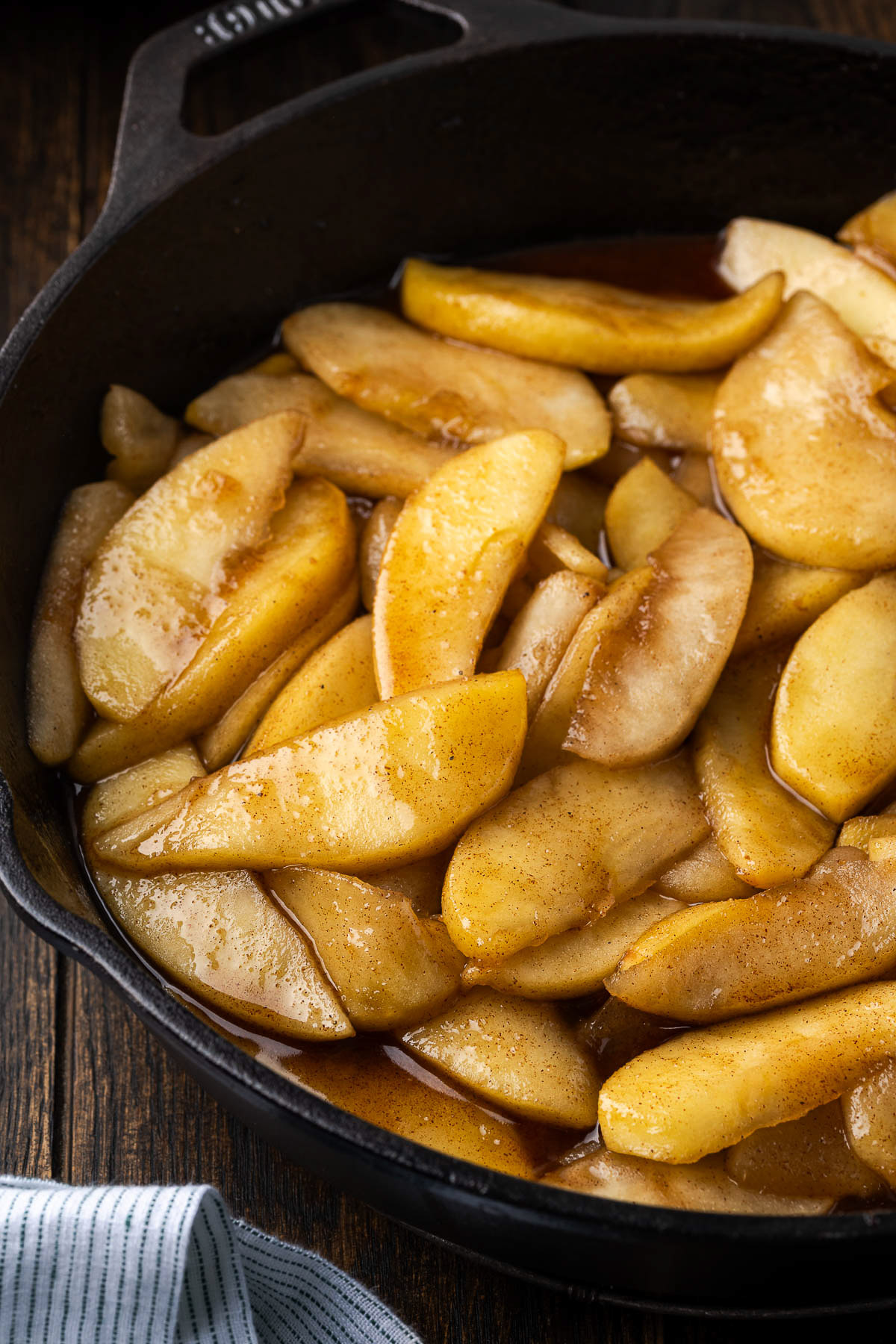 finished cast iron cinnamon apples cooked until golden and tender in brown sugar glaze