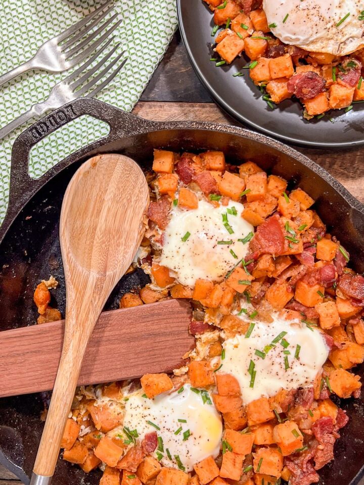 Sweet potato hash with eggs in a Lodge cast iron skillet ready to serve