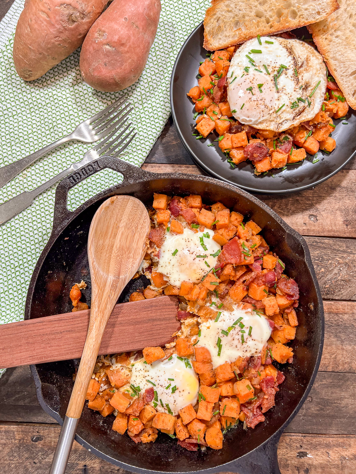 Sweet potato breakfast hash with eggs in a cast iron skillet alongside a plated serving and raw sweet potatoes.