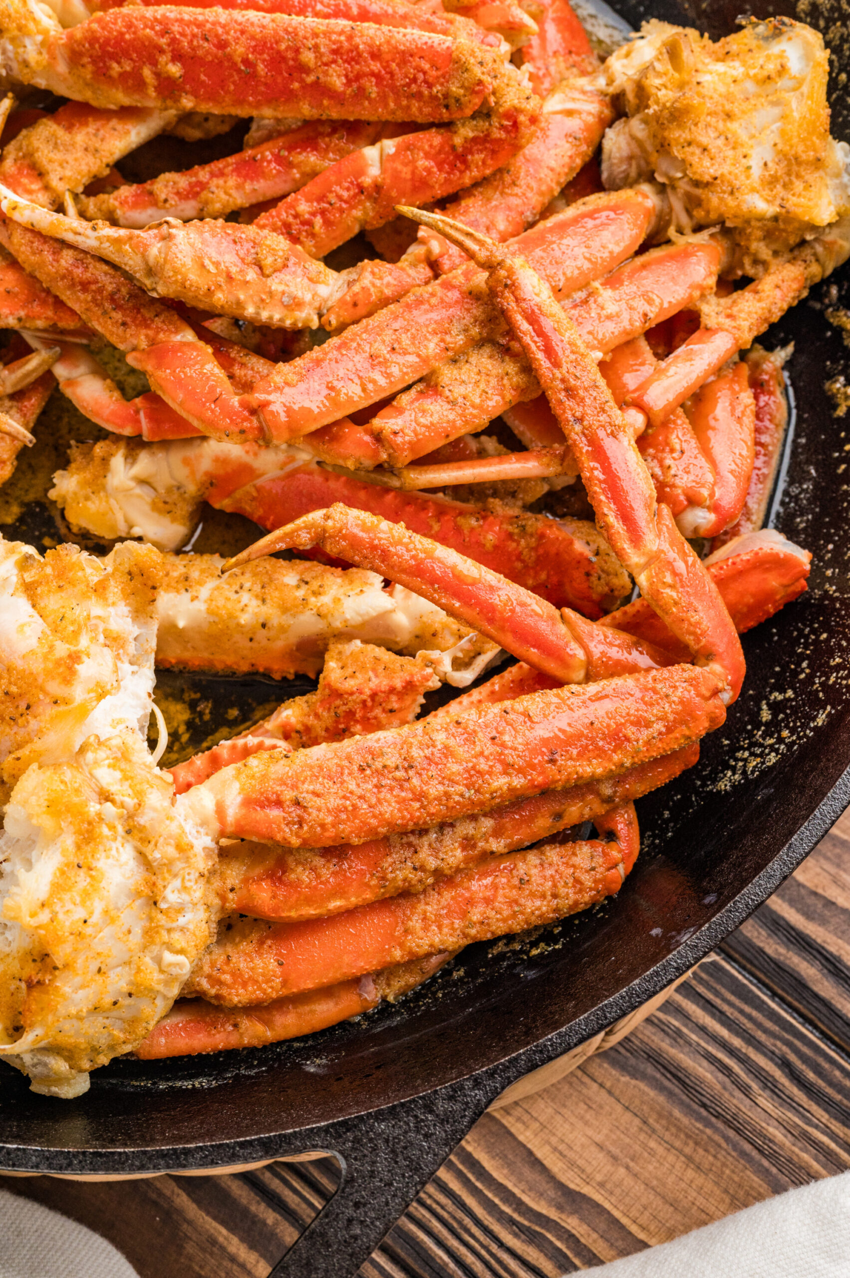 The crab legs done removed from the slow cooker to serve.