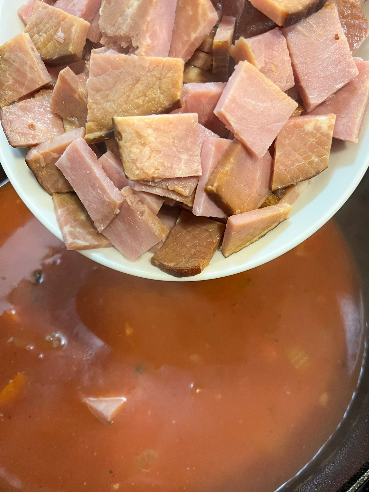 Finished ham and bean soup in a Dutch oven ready to serve