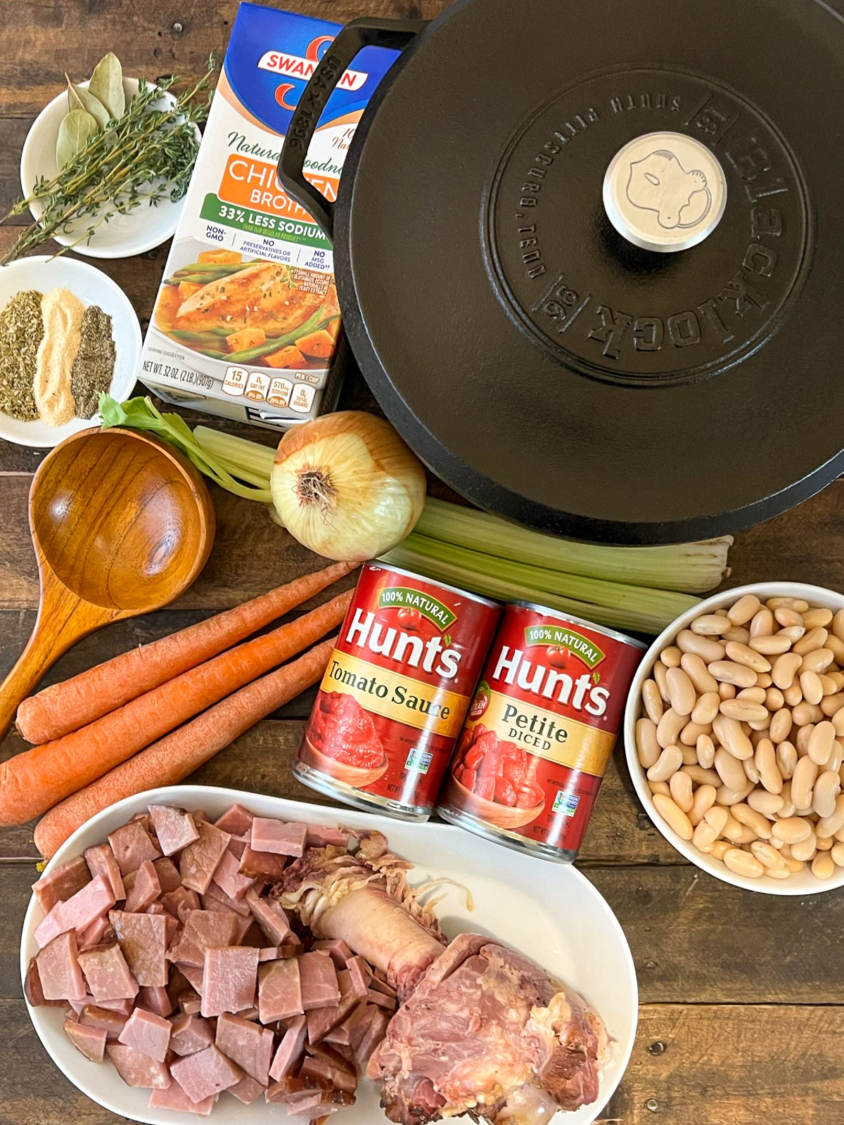Ham and bean soup ingredients laid out on a cutting board