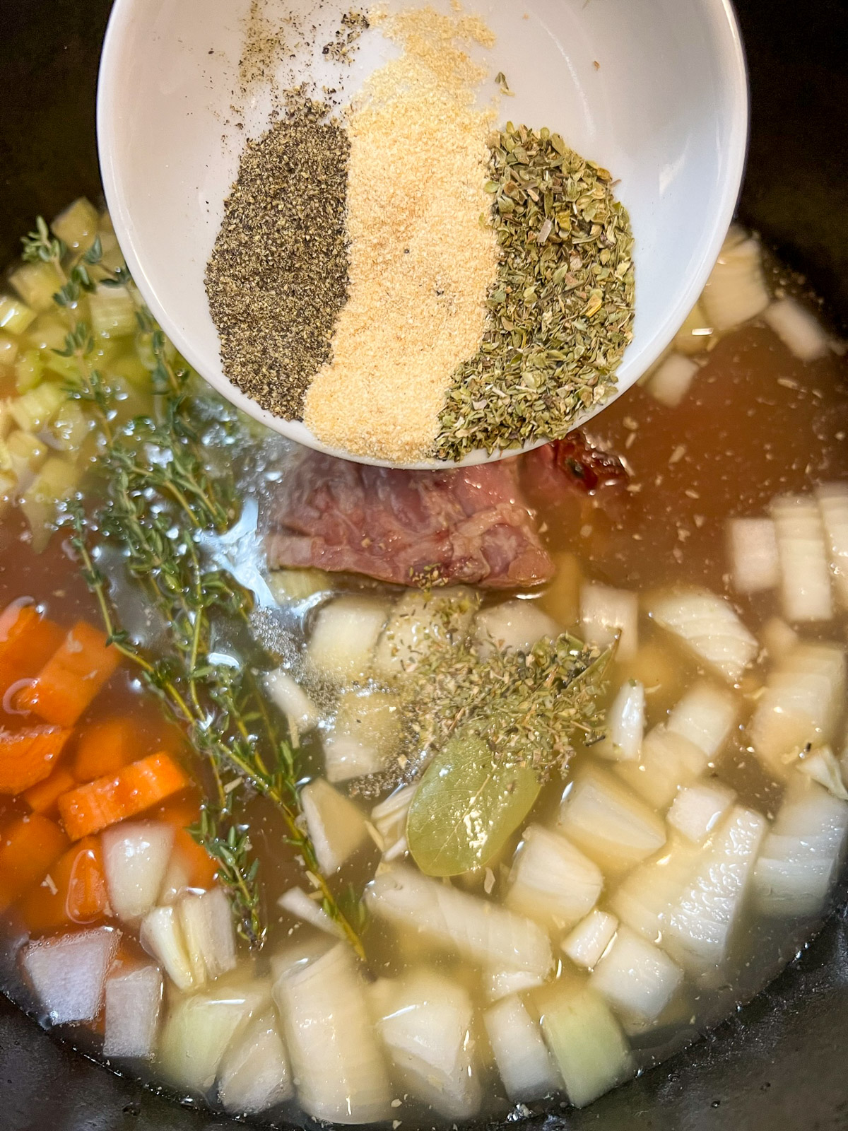 Ham and bean soup simmering in a Dutch oven