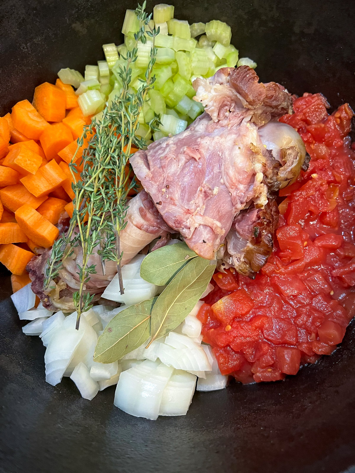 Ham and vegetables sauteing in a Dutch oven