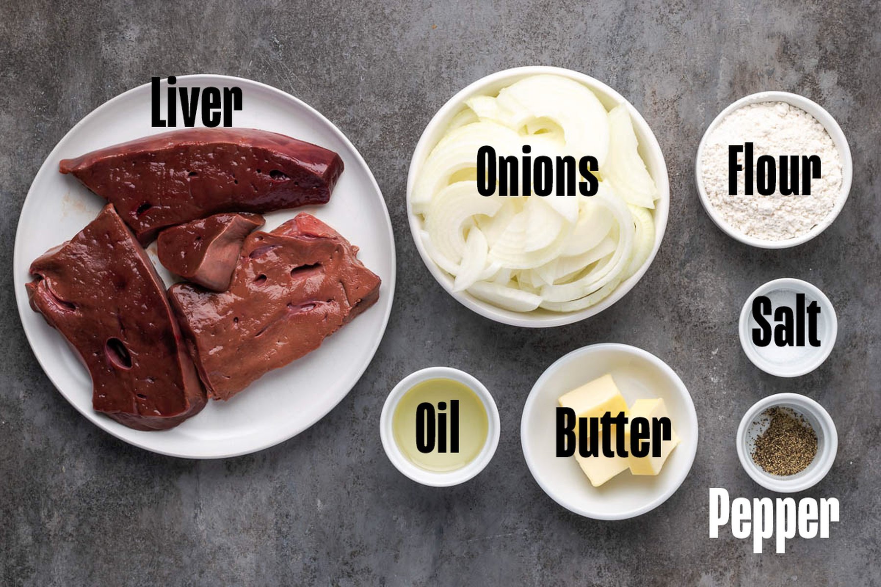 Liver and onions recipe ingredients on a cutting board