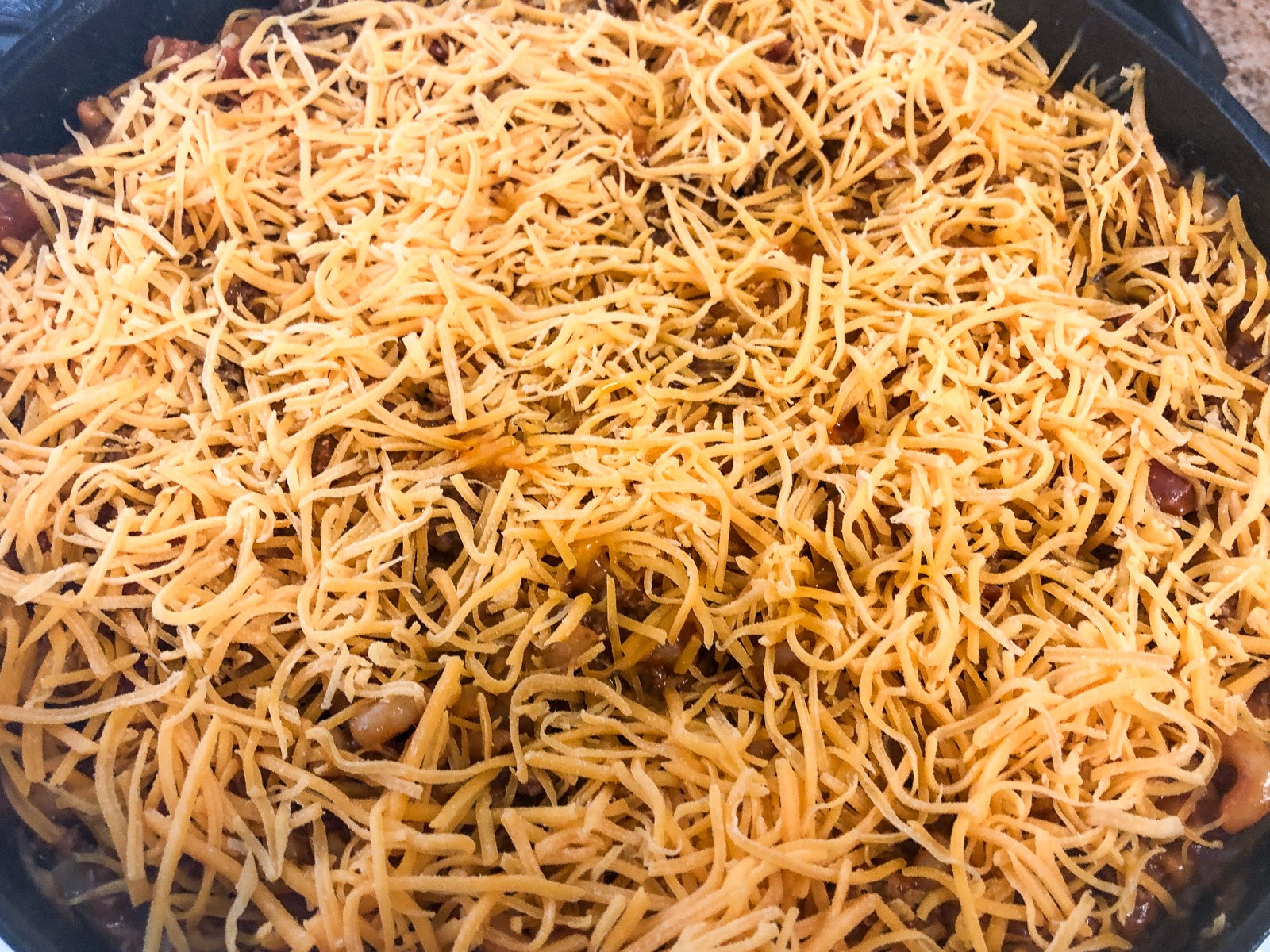 Cooked elbow macaroni for cheeseburger casserole.