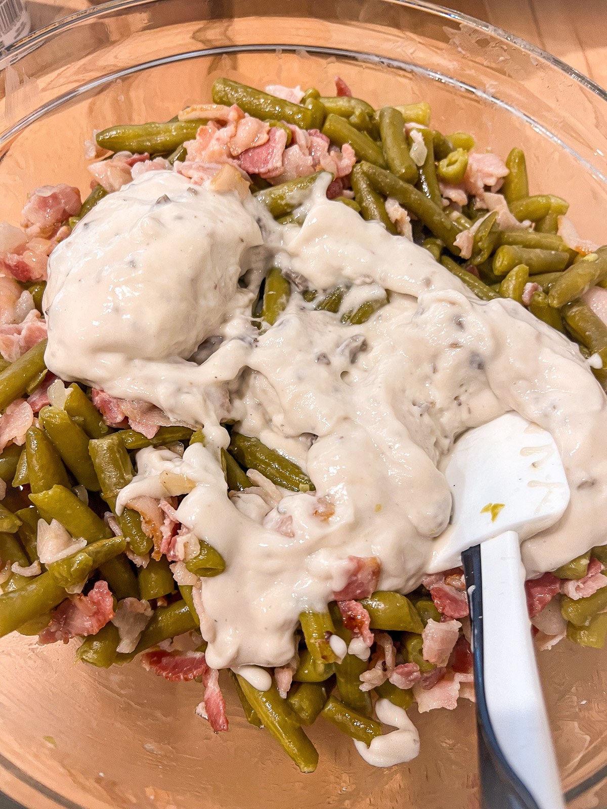 Cream of mushroom soup added to the green bean and bacon mixture.