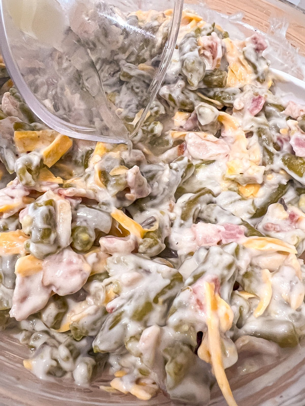 Shredded cheddar cheese and lemon juice stirred into the green bean mixture.