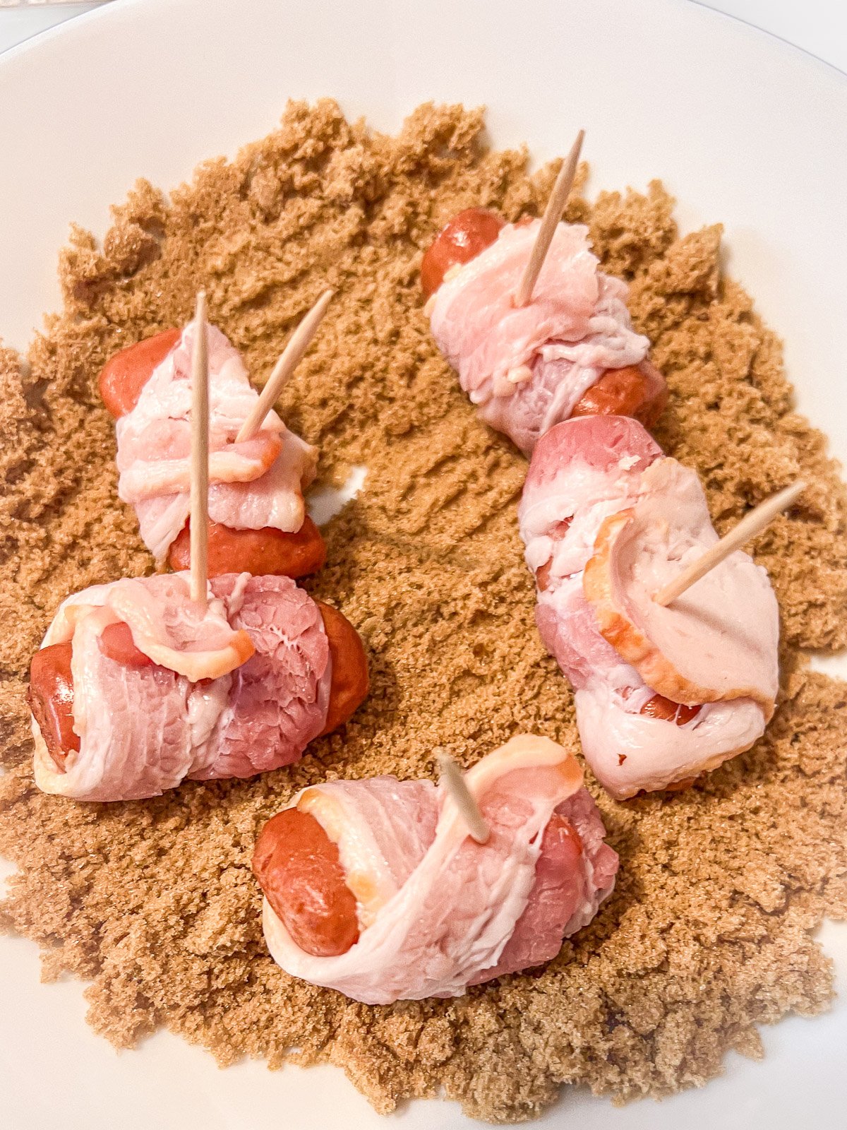 Wrapped smokies coated in the brown sugar mixture.