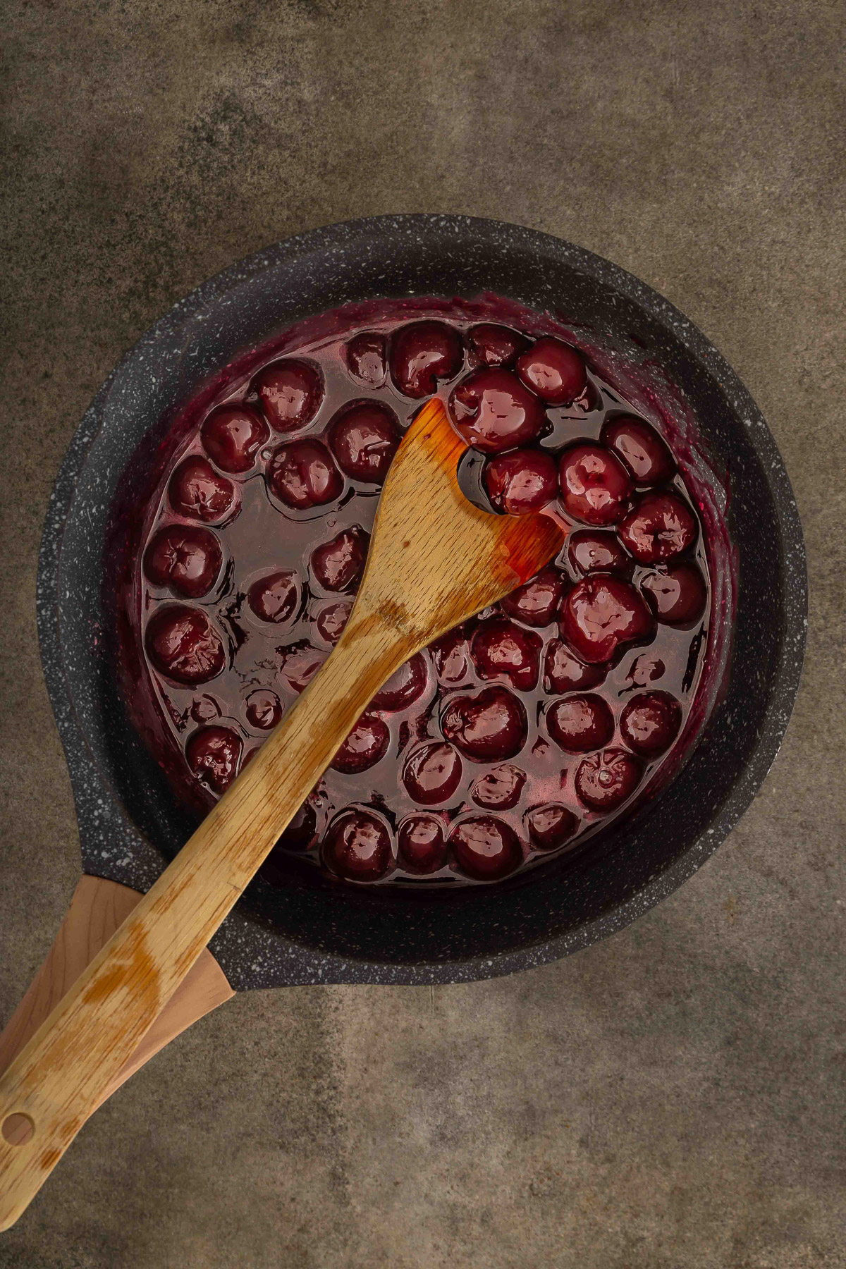 Cooking cherry cobbler filling until thick and glossy