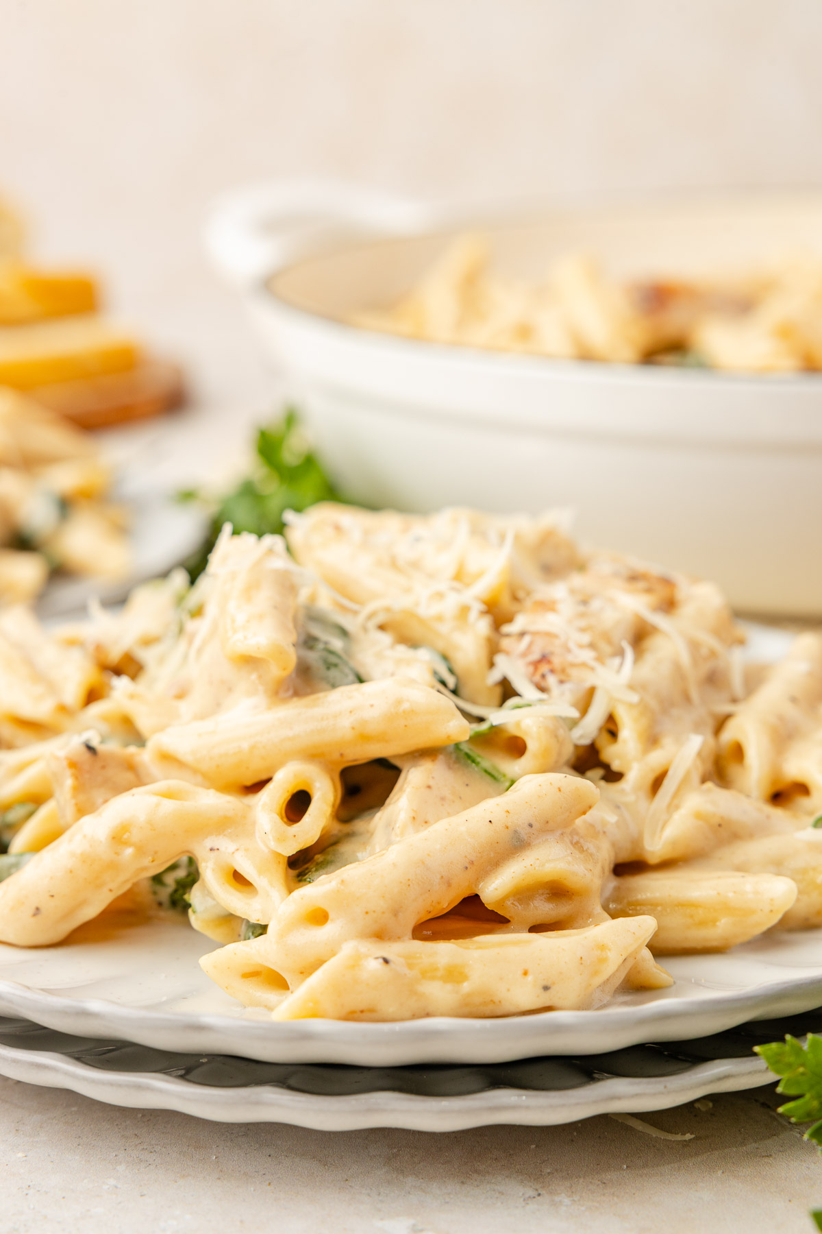 Creamy chicken Florentine pasta served on a stacked plate