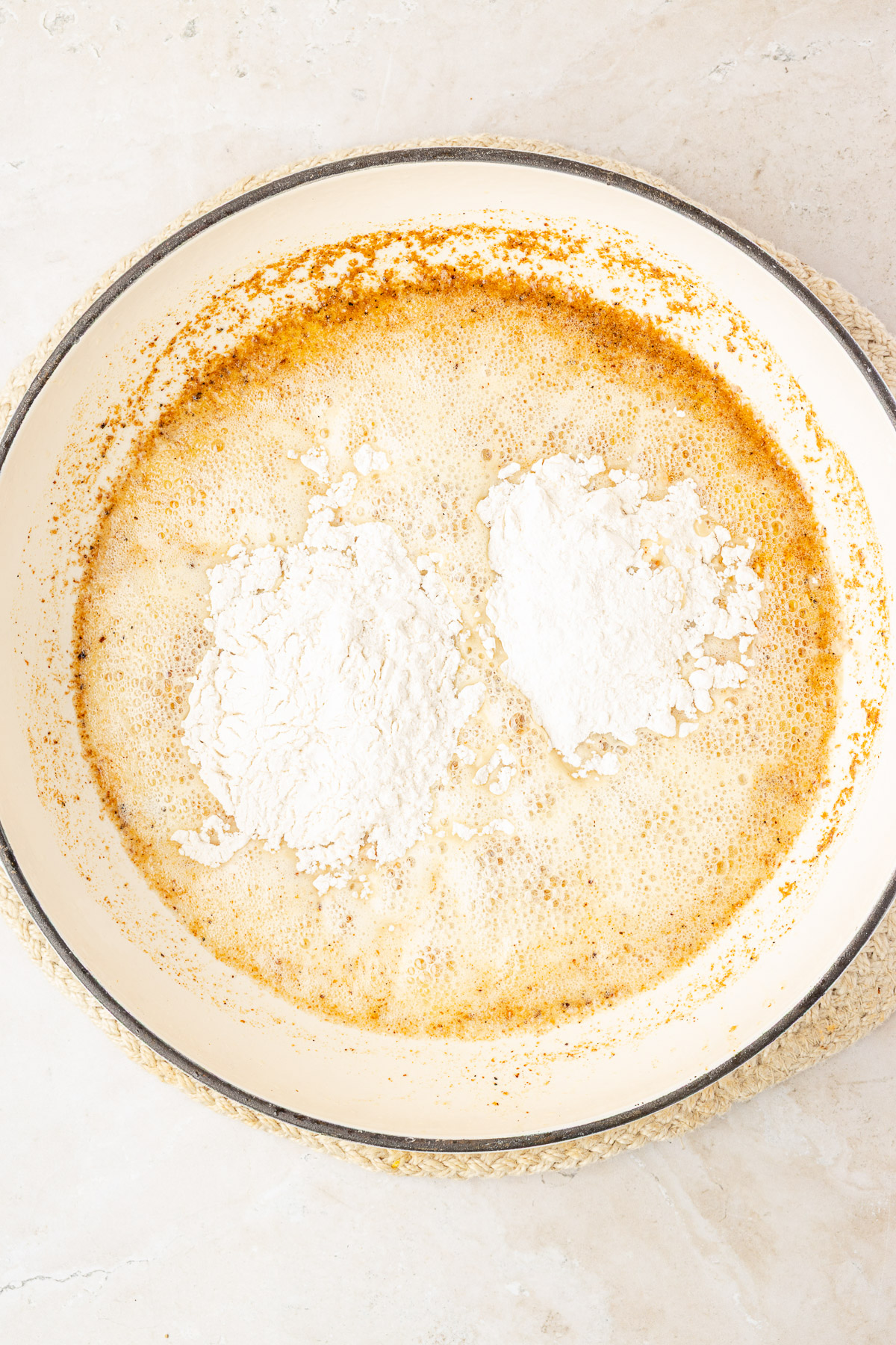 Butter and flour roux cooking in a skillet until golden