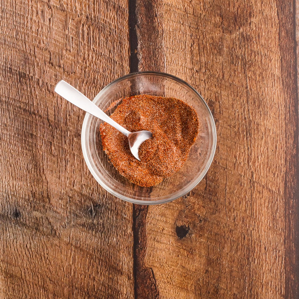 BBQ dry rub mixed in a small glass bowl for pork belly burnt ends