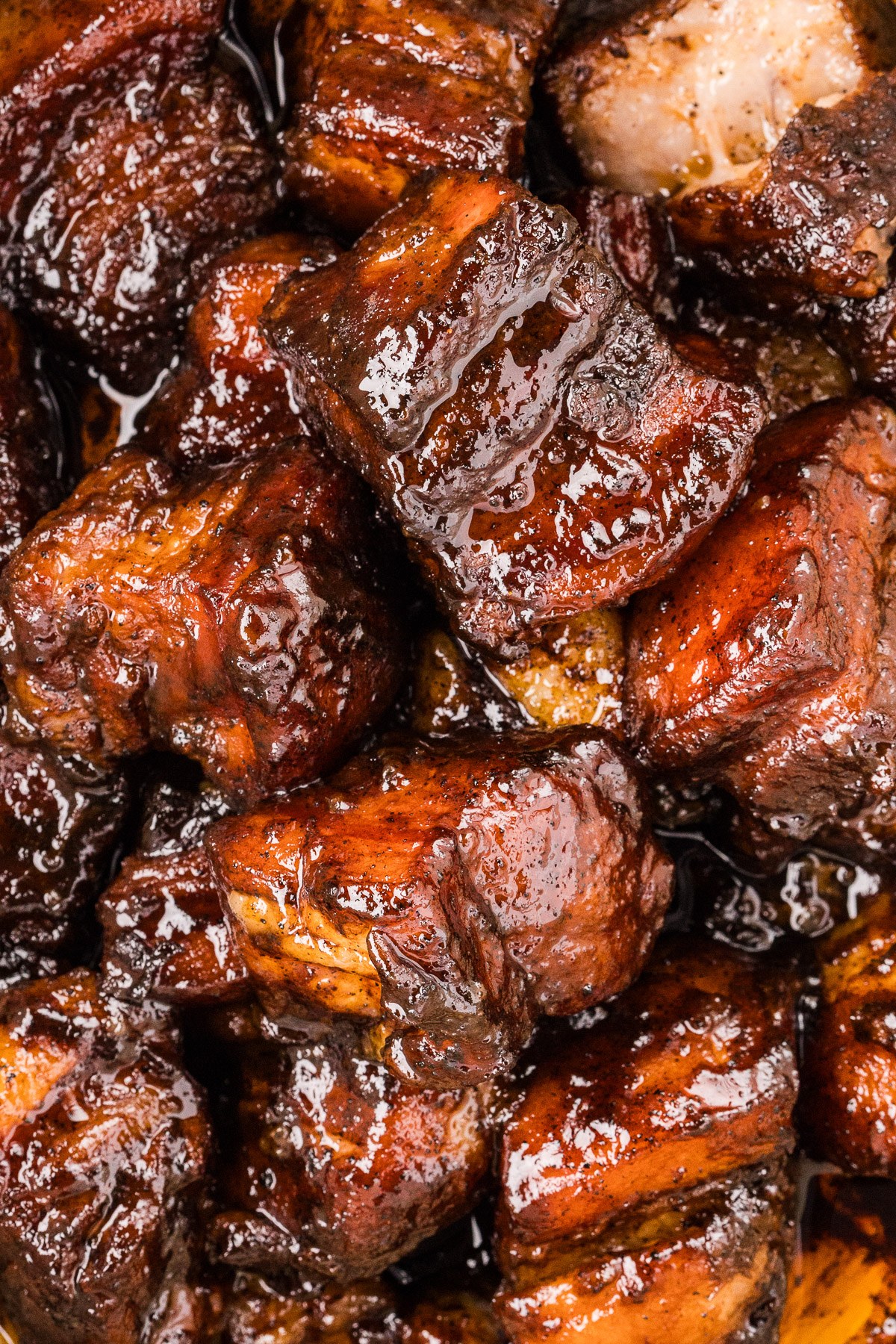 Pork belly burnt ends with caramelized mahogany glaze close up