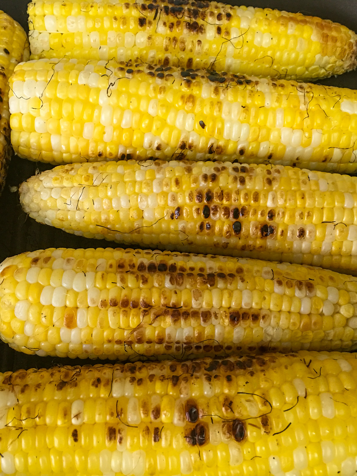 Fresh sweet corn charred on the grill for roasted poblano corn chowder.