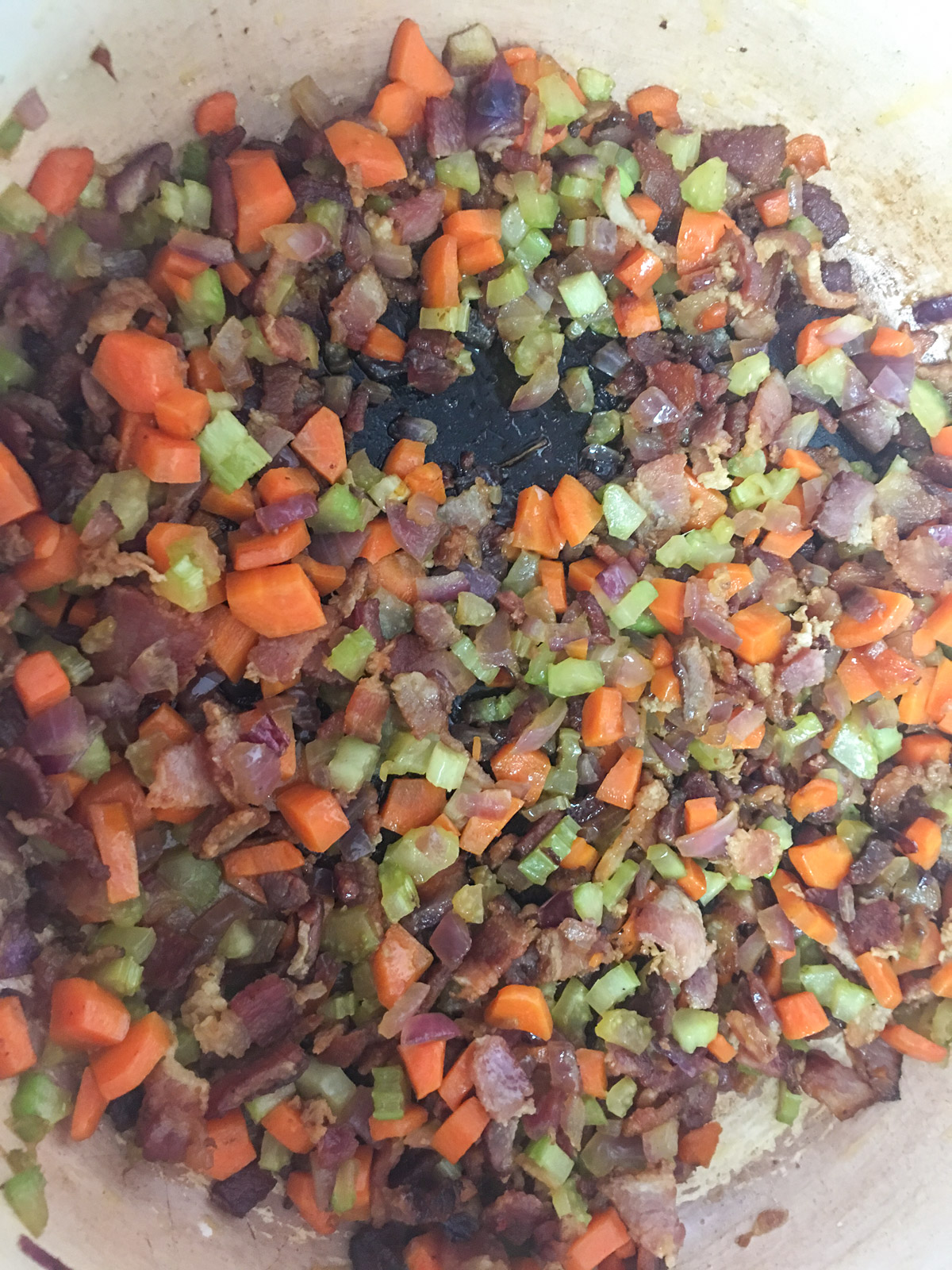 Bacon, onion, celery, carrot, and garlic sauteed in a Dutch oven.