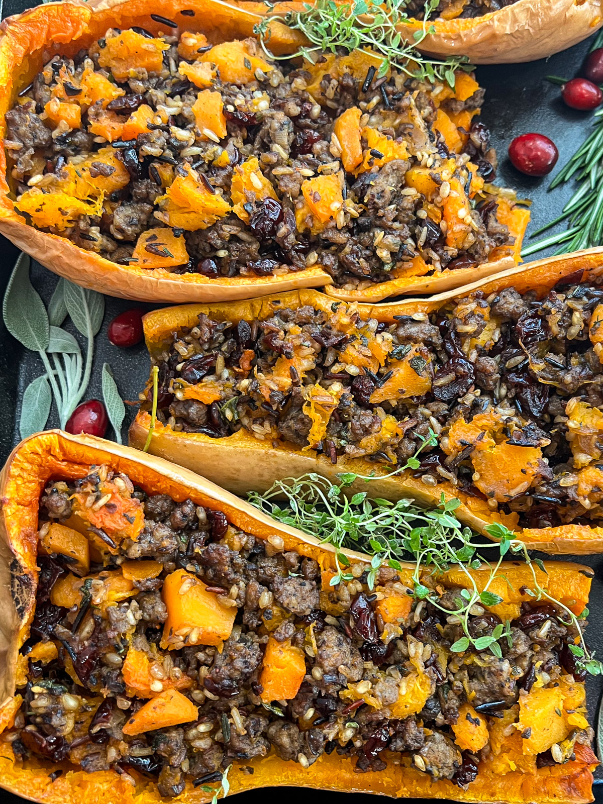 Sausage stuffed butternut squash with wild rice ready to serve.