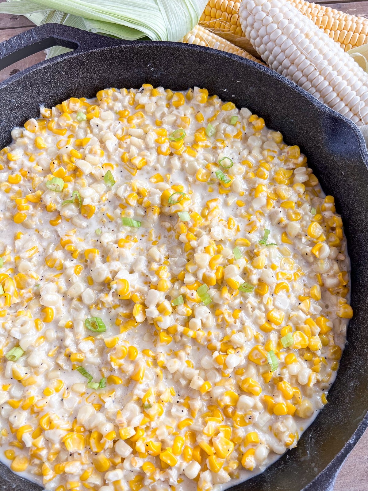 Southern creamed corn made with fresh corn in a cast iron skillet.